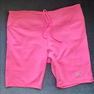 Hot pink Nike biker shorts.
